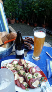 tomato and cheese salad, bread, sausages, and a hearty Franconian beer